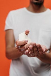 a person washing hands after providing regulated medical waste removal service in Denver